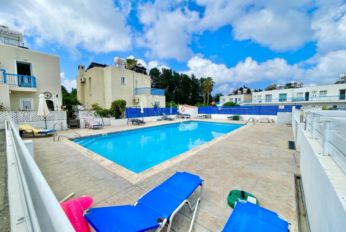 Ground-Floor Apartment with Private Outdoor Area and Communal Swimming Pool
