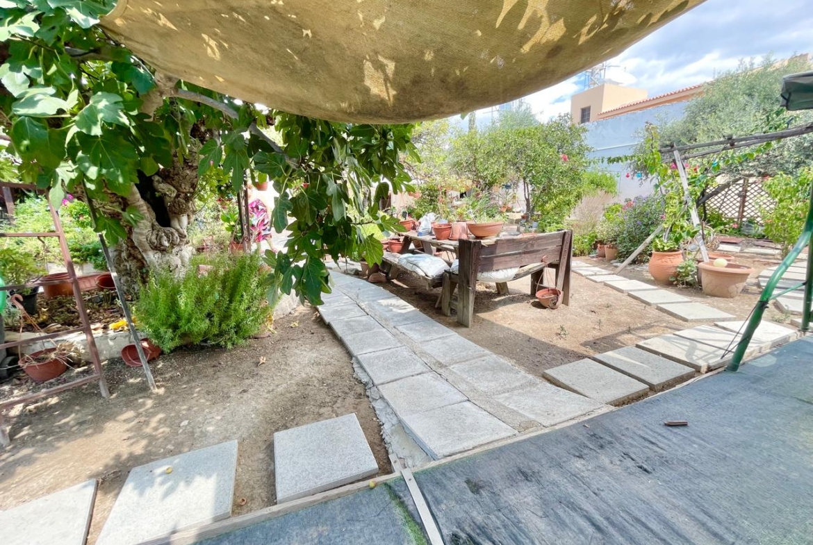 Traditional 3-Bedroom Stone Bungalow Surrounded by a Mature Garden