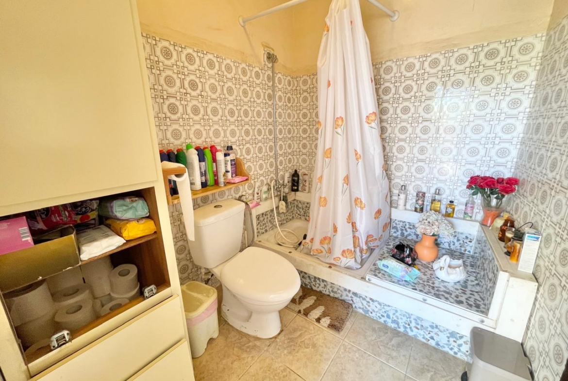 Traditional 3-Bedroom Stone Bungalow Surrounded by a Mature Garden