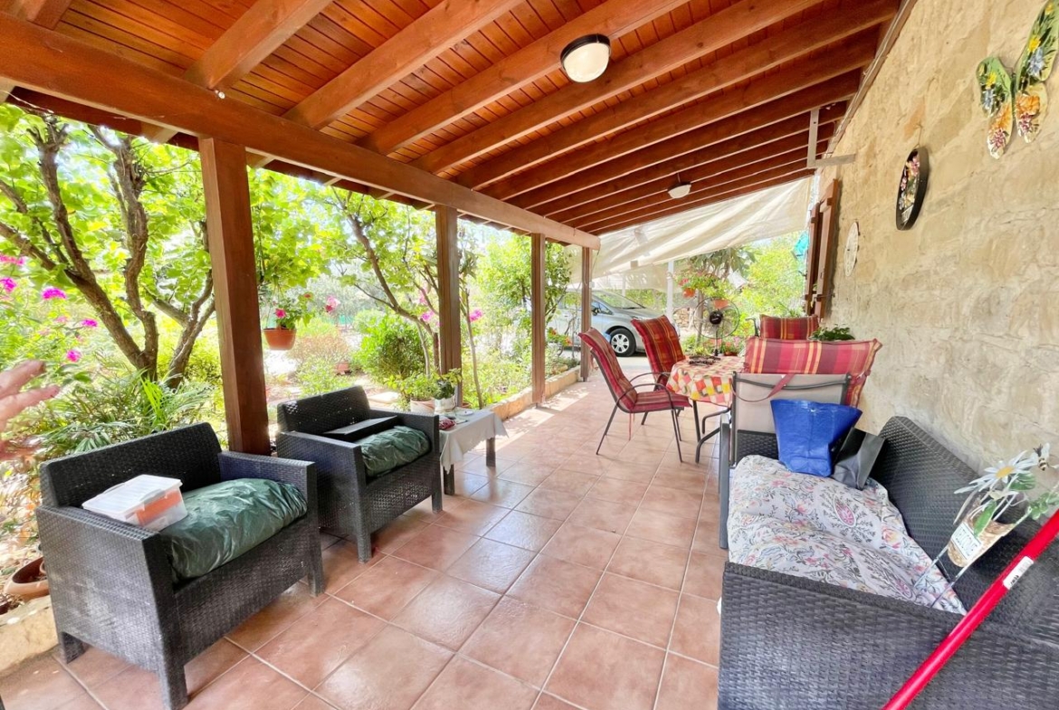 Traditional 3-Bedroom Stone Bungalow Surrounded by a Mature Garden