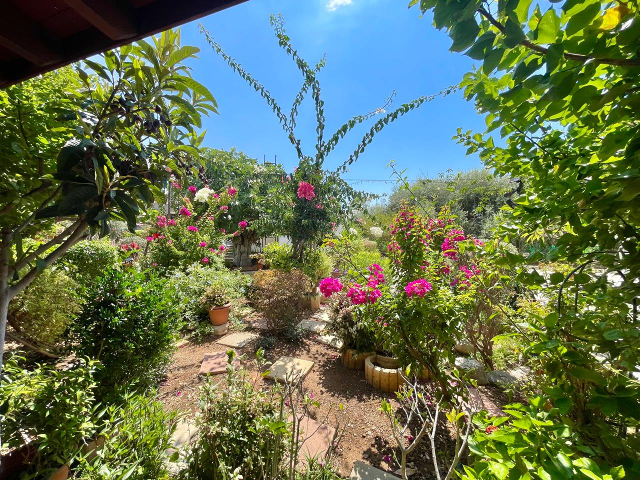 Traditional 3-Bedroom Stone Bungalow Surrounded by a Mature Garden