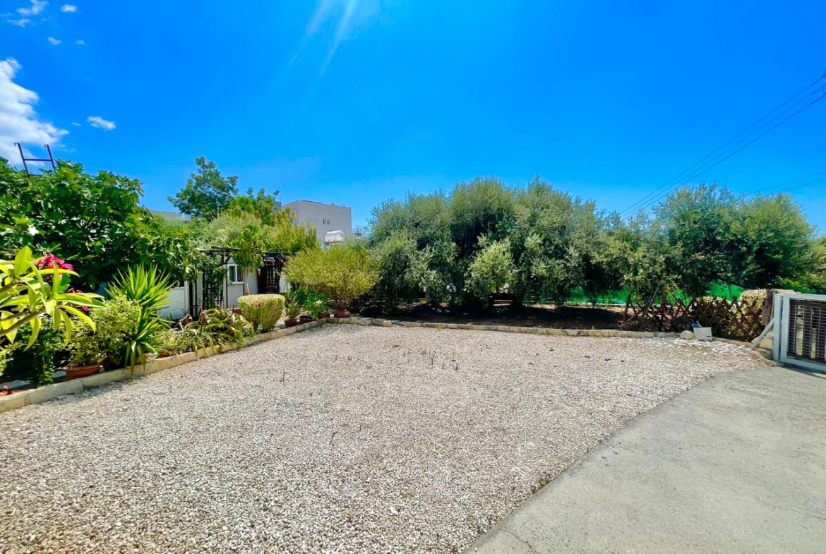 Traditional 3-Bedroom Stone Bungalow Surrounded by a Mature Garden