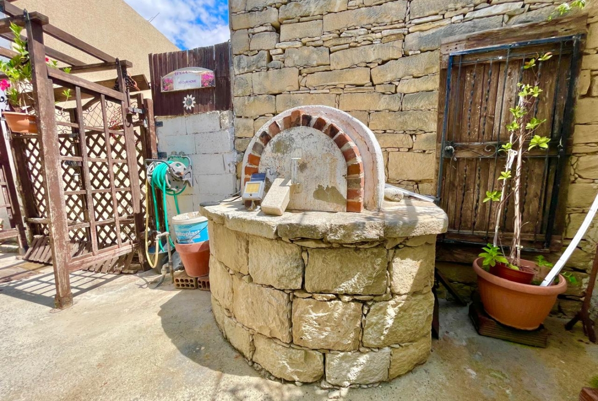Traditional 3-Bedroom Stone Bungalow Surrounded by a Mature Garden