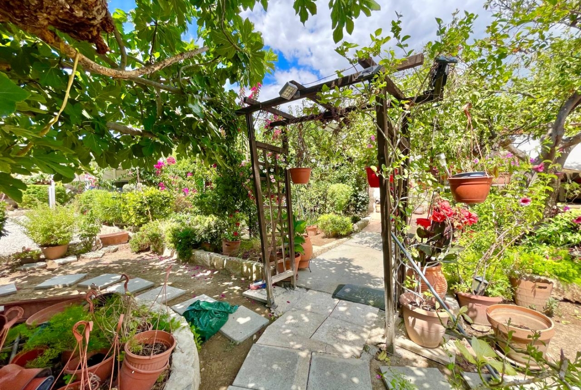 Traditional 3-Bedroom Stone Bungalow Surrounded by a Mature Garden
