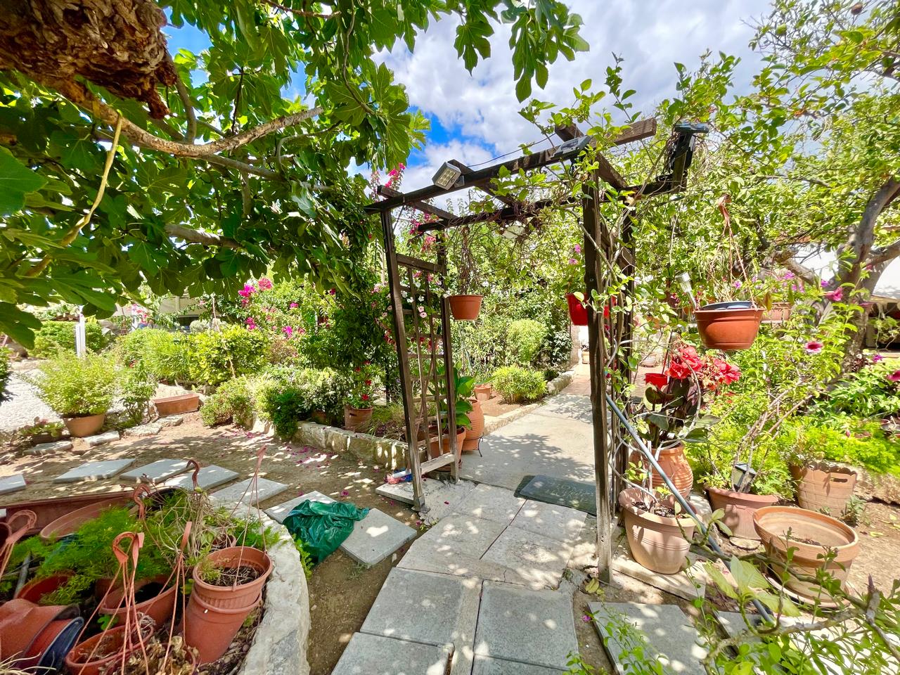 Traditional 3-Bedroom Stone Bungalow Surrounded by a Mature Garden