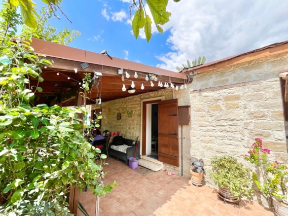 Traditional 3-Bedroom Stone Bungalow Surrounded by a Mature Garden