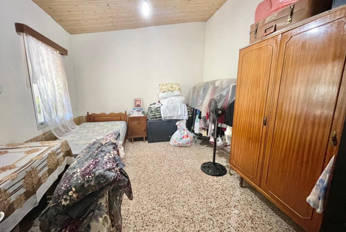 Traditional 3-Bedroom Stone Bungalow Surrounded by a Mature Garden