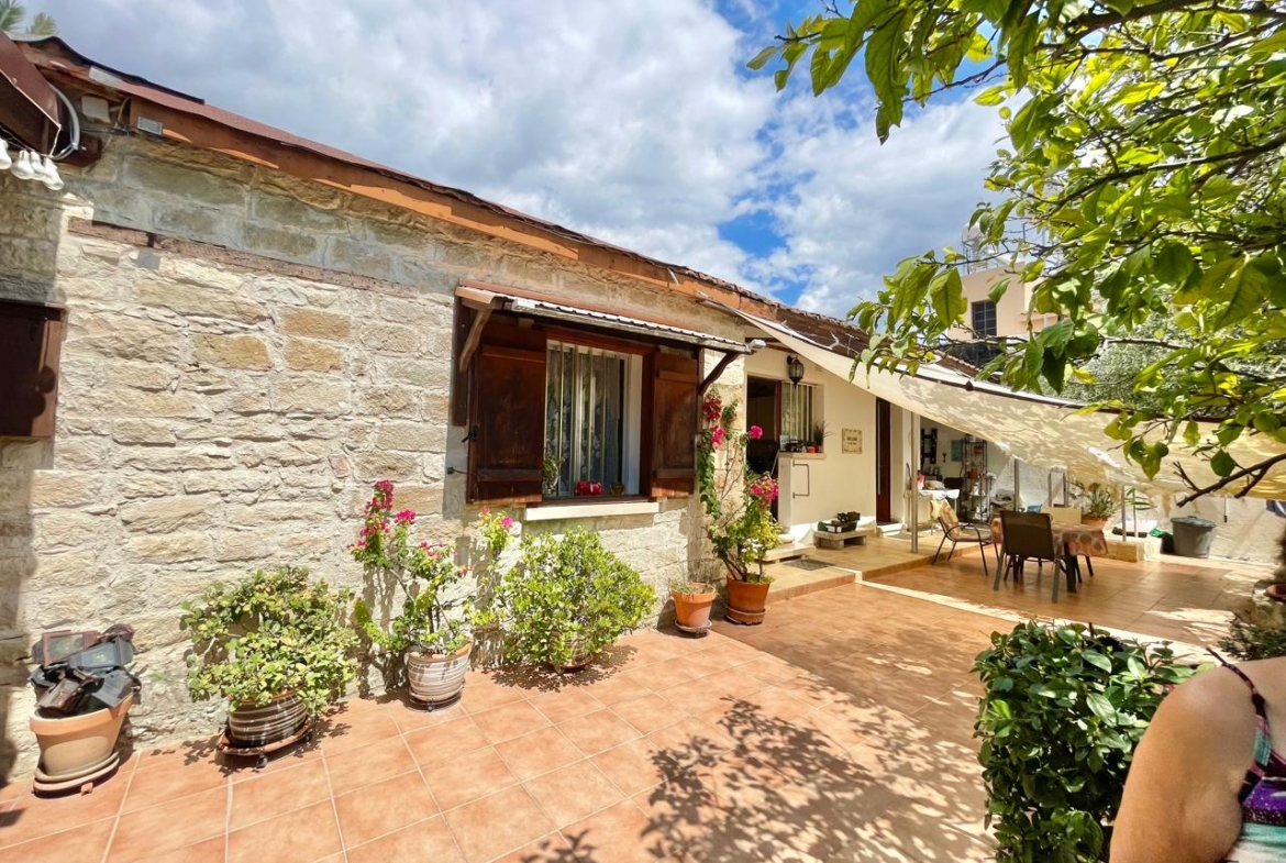 Traditional 3-Bedroom Stone Bungalow Surrounded by a Mature Garden