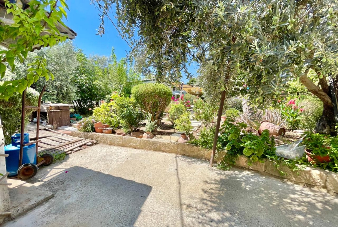 Traditional 3-Bedroom Stone Bungalow Surrounded by a Mature Garden