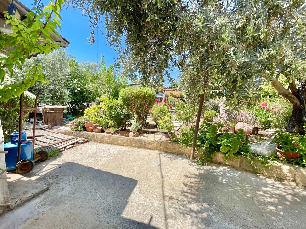 Traditional 3-Bedroom Stone Bungalow Surrounded by a Mature Garden