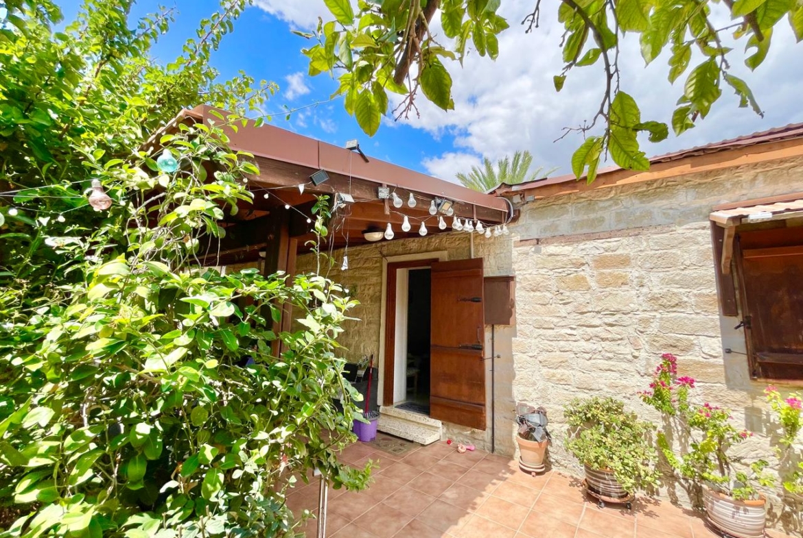 Traditional 3-Bedroom Stone Bungalow Surrounded by a Mature Garden
