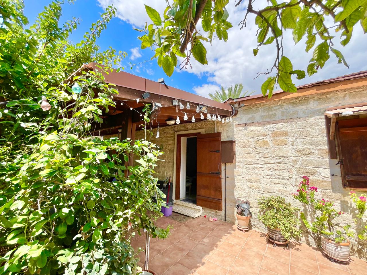 Traditional 3-Bedroom Stone Bungalow Surrounded by a Mature Garden