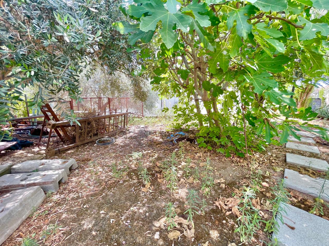 Traditional 3-Bedroom Stone Bungalow Surrounded by a Mature Garden