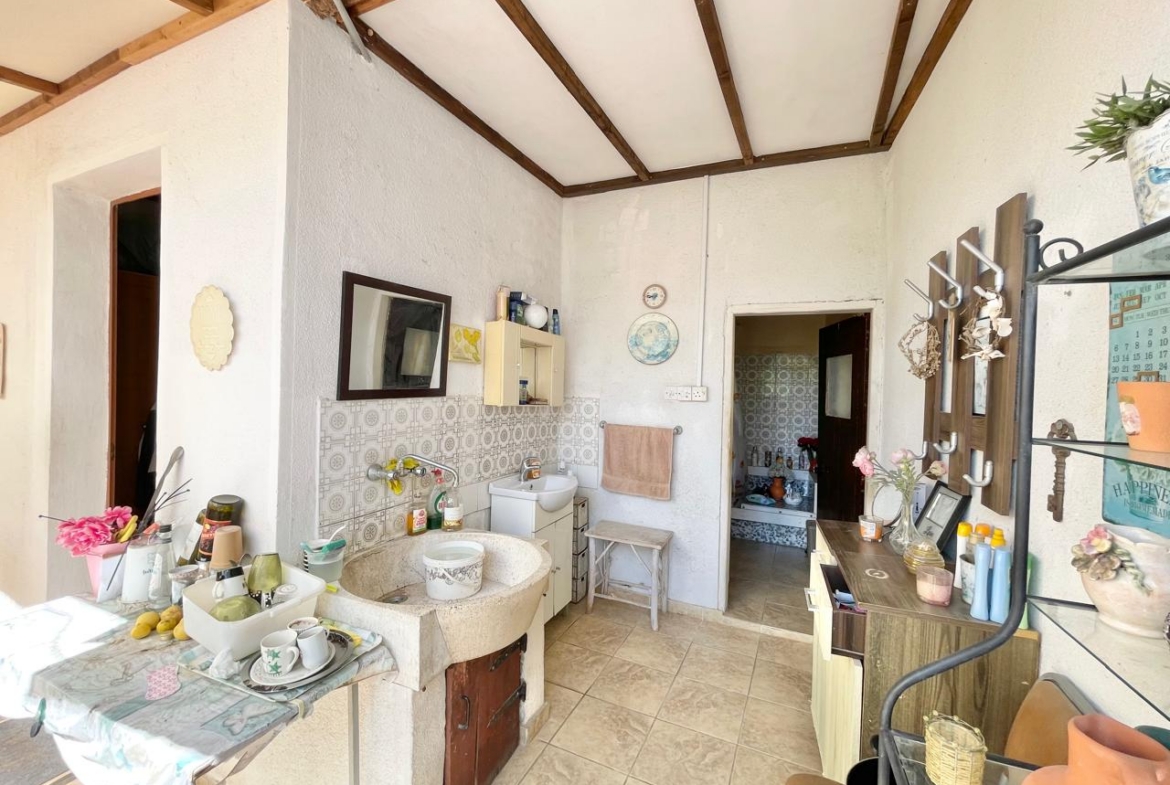 Traditional 3-Bedroom Stone Bungalow Surrounded by a Mature Garden