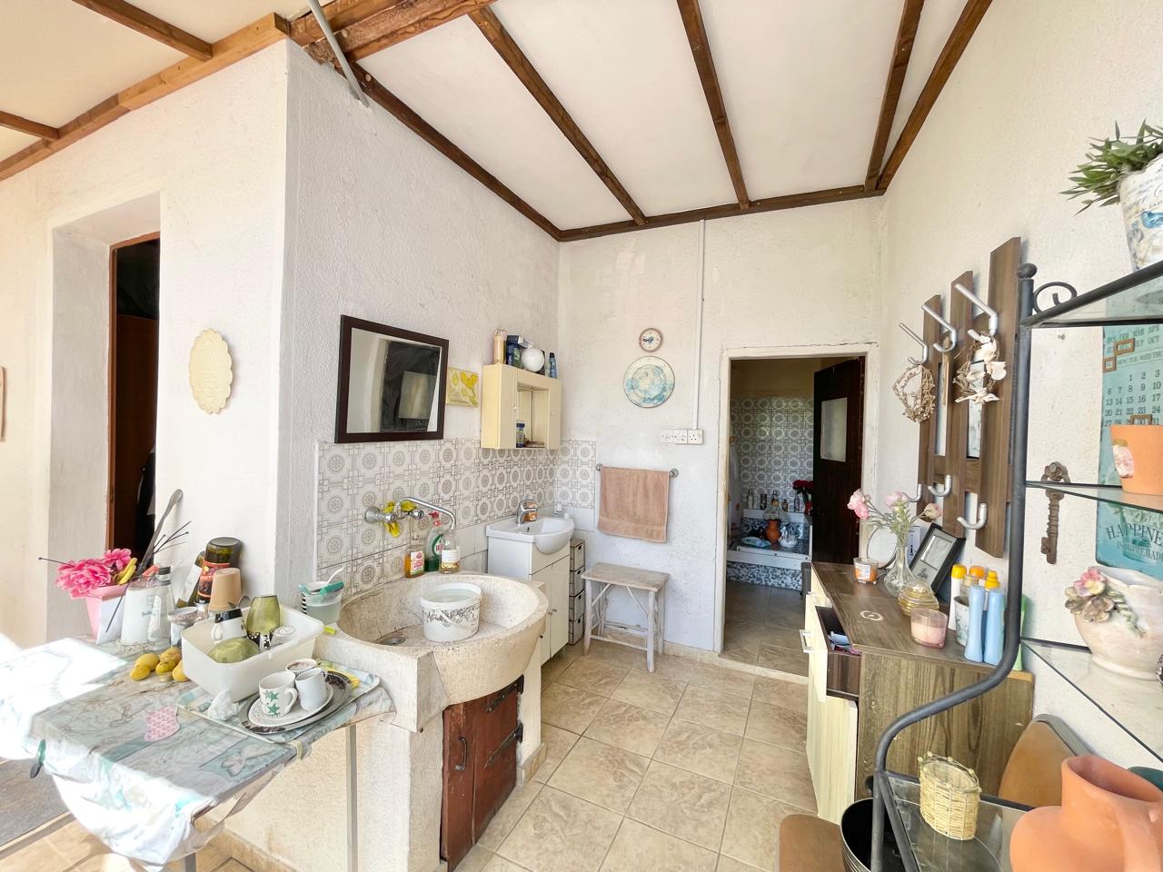 Traditional 3-Bedroom Stone Bungalow Surrounded by a Mature Garden