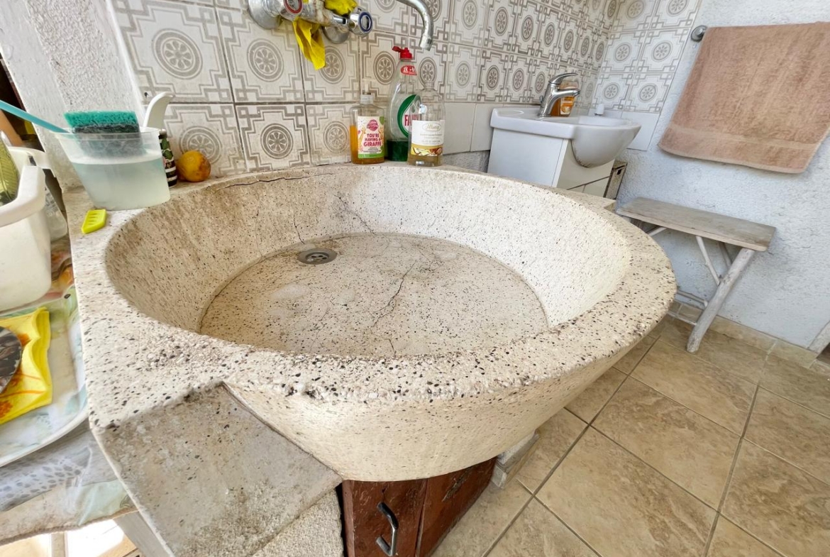 Traditional 3-Bedroom Stone Bungalow Surrounded by a Mature Garden