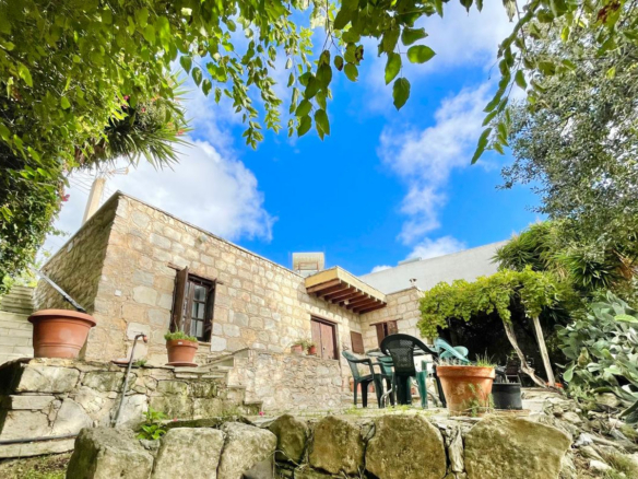 One-bedroom stone cottage with a fireplace and a beautiful green garden