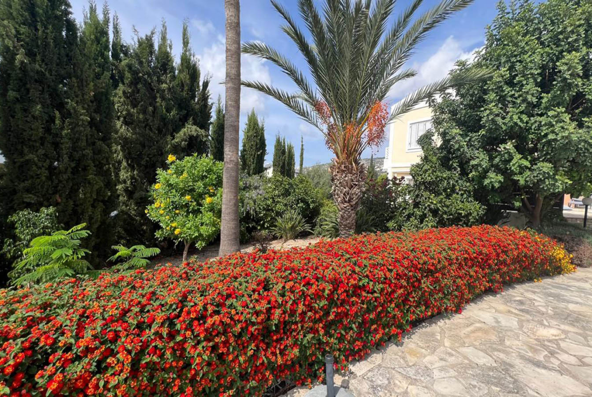 Two-bedroom villa with a private garden and communal swimming pool
