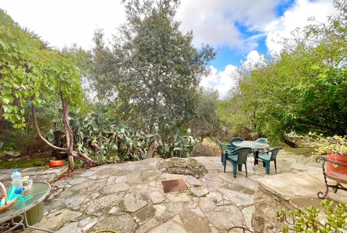 One-bedroom stone cottage with a fireplace and a beautiful green garden