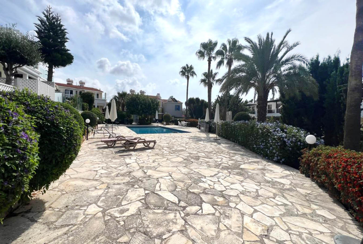 Two-bedroom villa with a private garden and communal swimming pool