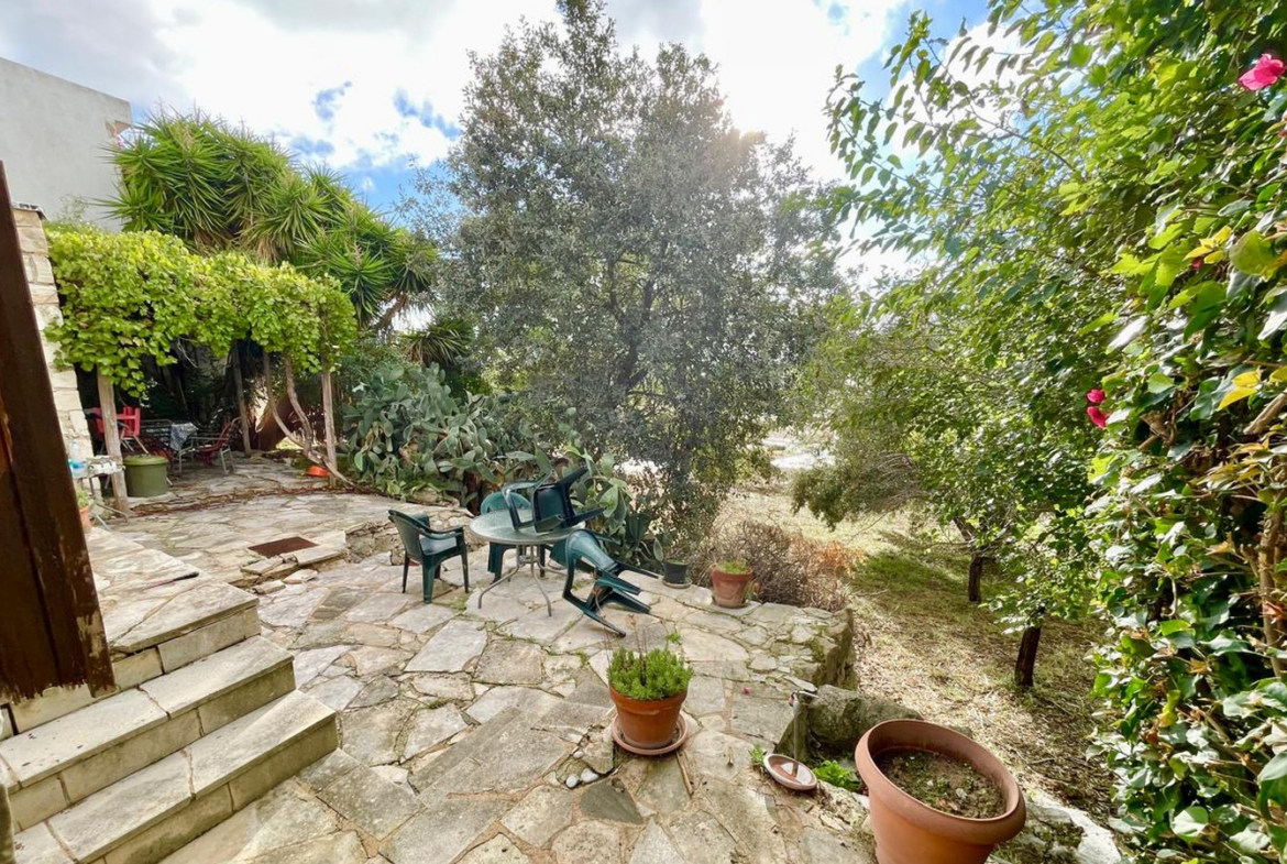 One-bedroom stone cottage with a fireplace and a beautiful green garden