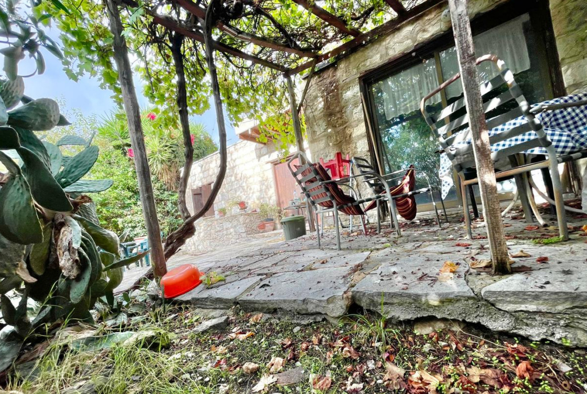 One-bedroom stone cottage with a fireplace and a beautiful green garden
