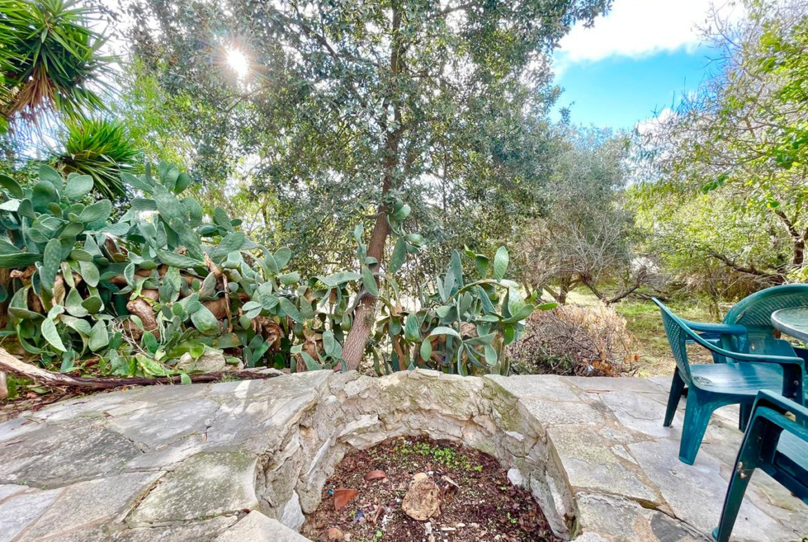 One-bedroom stone cottage with a fireplace and a beautiful green garden