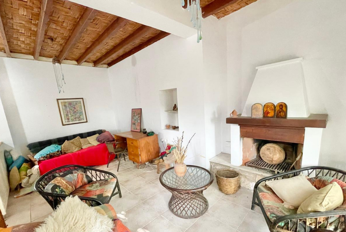One-bedroom stone cottage with a fireplace and a beautiful green garden