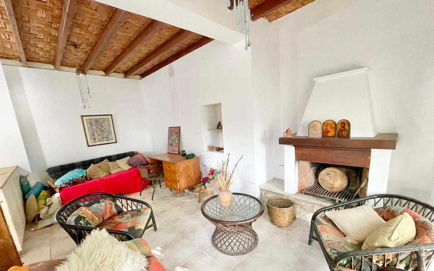 12_Interior_stone-house-for-sale-paphos-cyprus One-bedroom stone cottage with a fireplace and a beautiful green garden