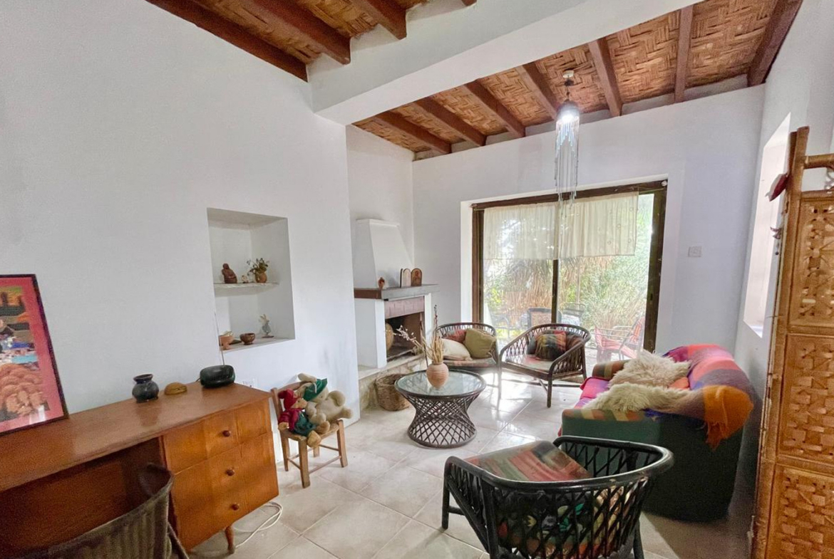 One-bedroom stone cottage with a fireplace and a beautiful green garden