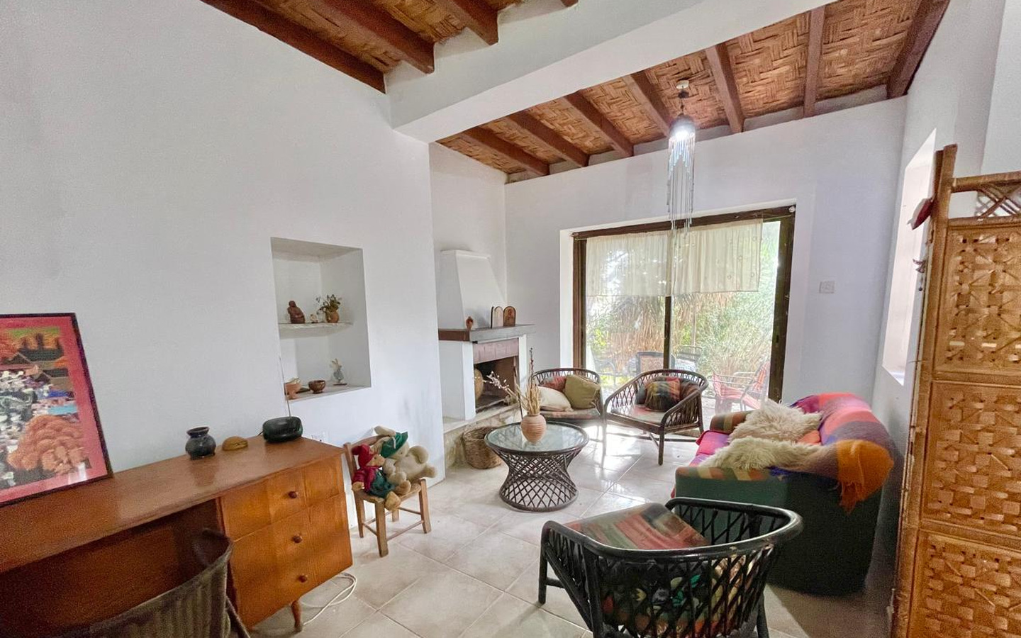 13_Interior_stone-house-for-sale-paphos-cyprus One-bedroom stone cottage with a fireplace and a beautiful green garden