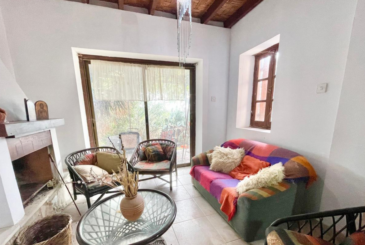 One-bedroom stone cottage with a fireplace and a beautiful green garden