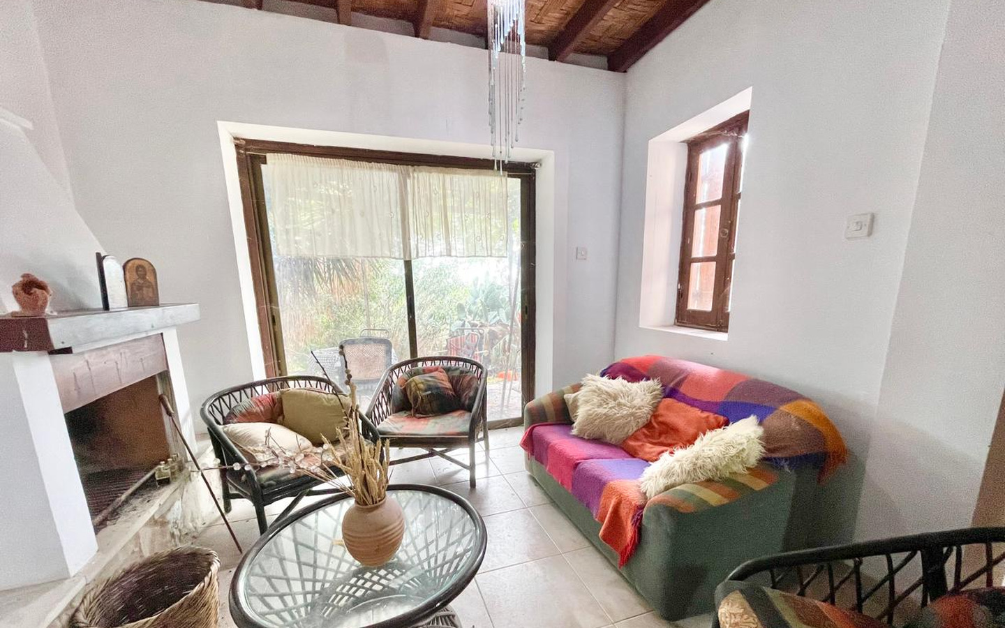 14_Interior_stone-house-for-sale-paphos-cyprus One-bedroom stone cottage with a fireplace and a beautiful green garden