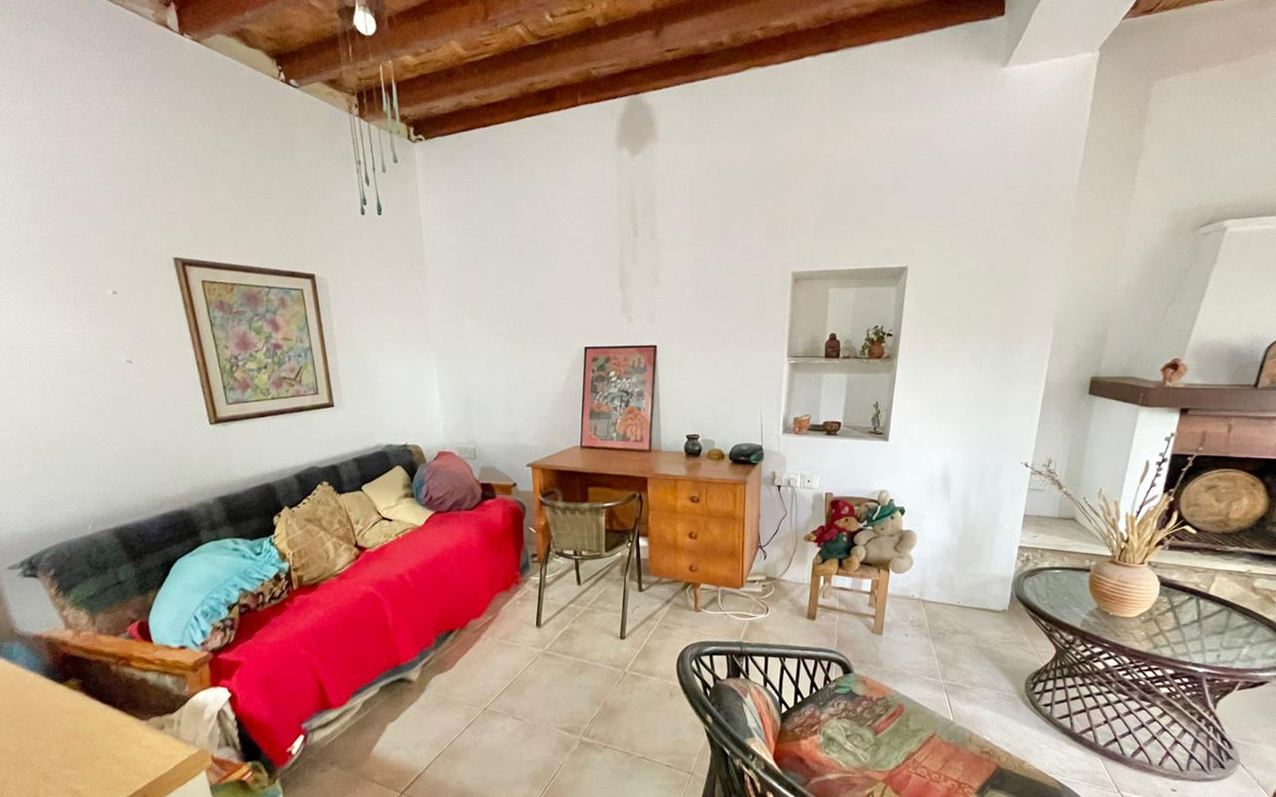 15_Interior_stone-house-for-sale-paphos-cyprus One-bedroom stone cottage with a fireplace and a beautiful green garden