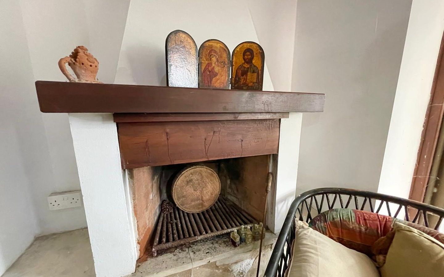 16_Interior_stone-house-for-sale-paphos-cyprus One-bedroom stone cottage with a fireplace and a beautiful green garden