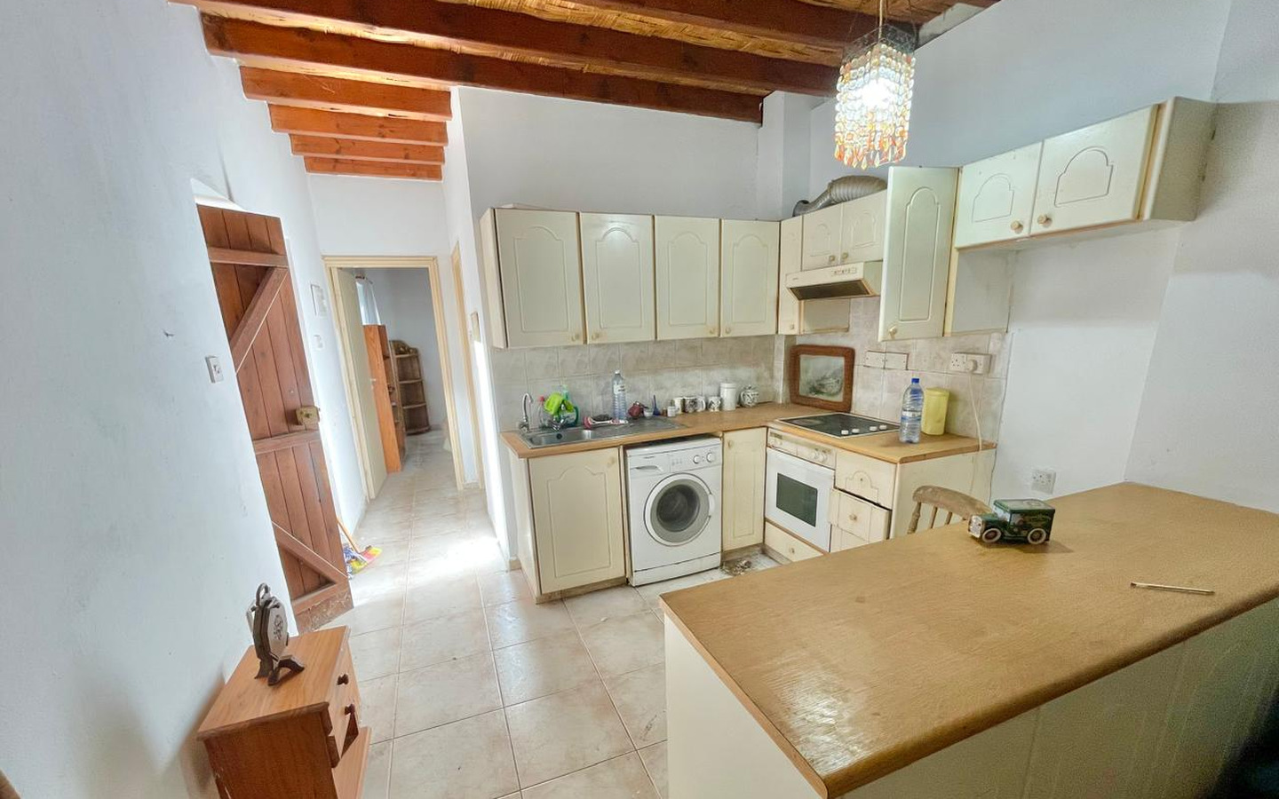 18_Interior_stone-house-for-sale-paphos-cyprus One-bedroom stone cottage with a fireplace and a beautiful green garden