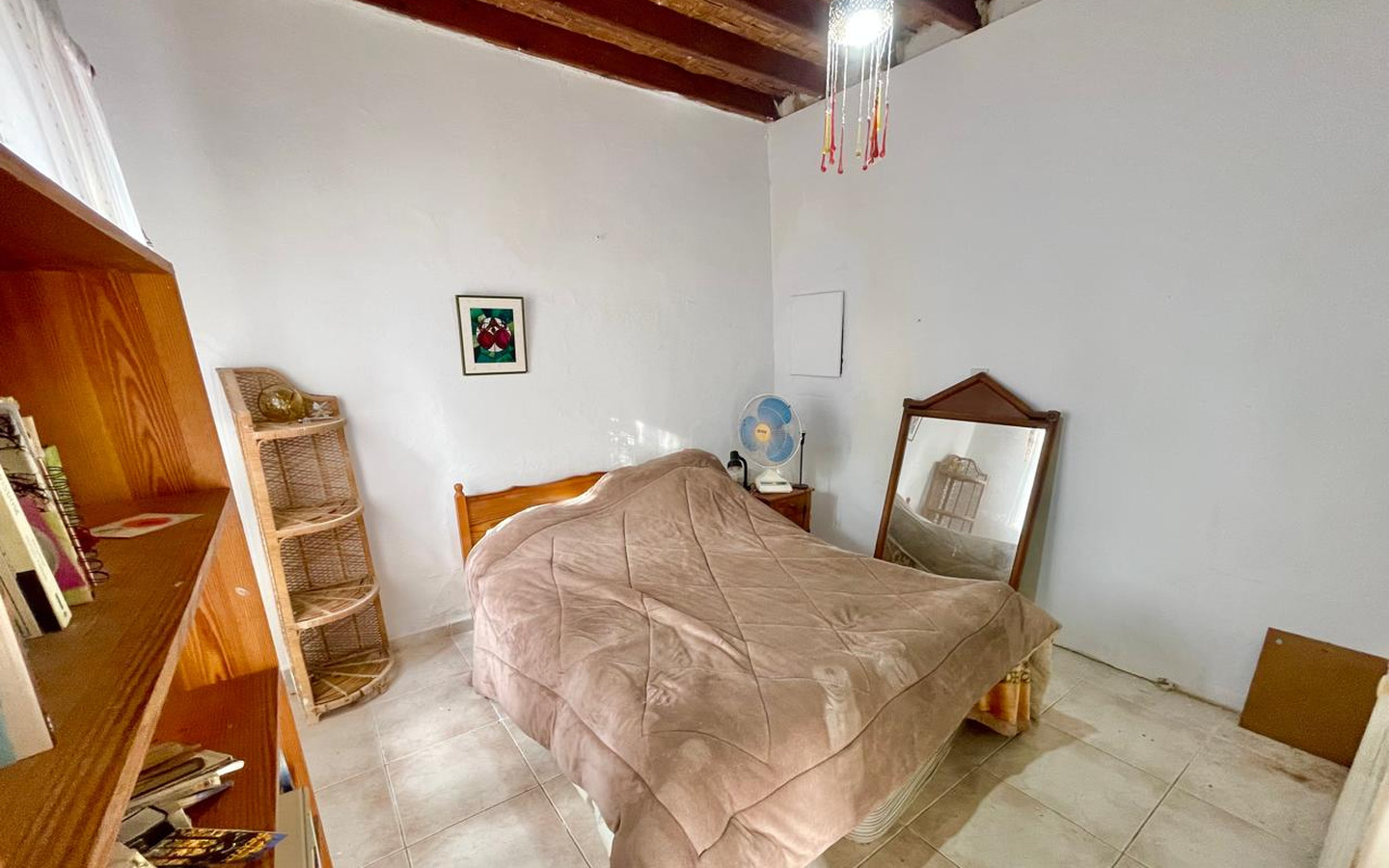 19_Interior_stone-house-for-sale-paphos-cyprus One-bedroom stone cottage with a fireplace and a beautiful green garden